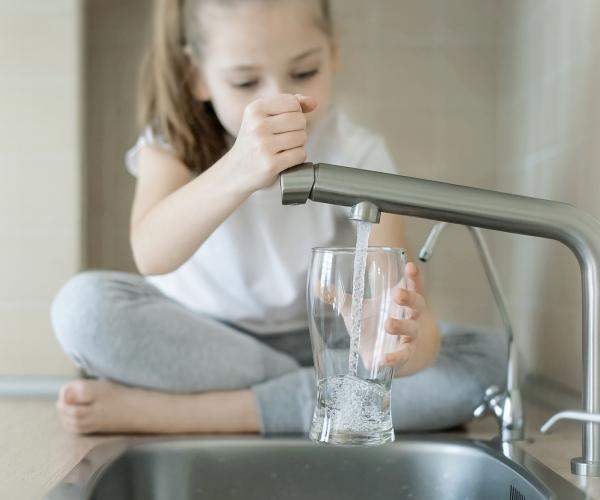 girl drinking tap water